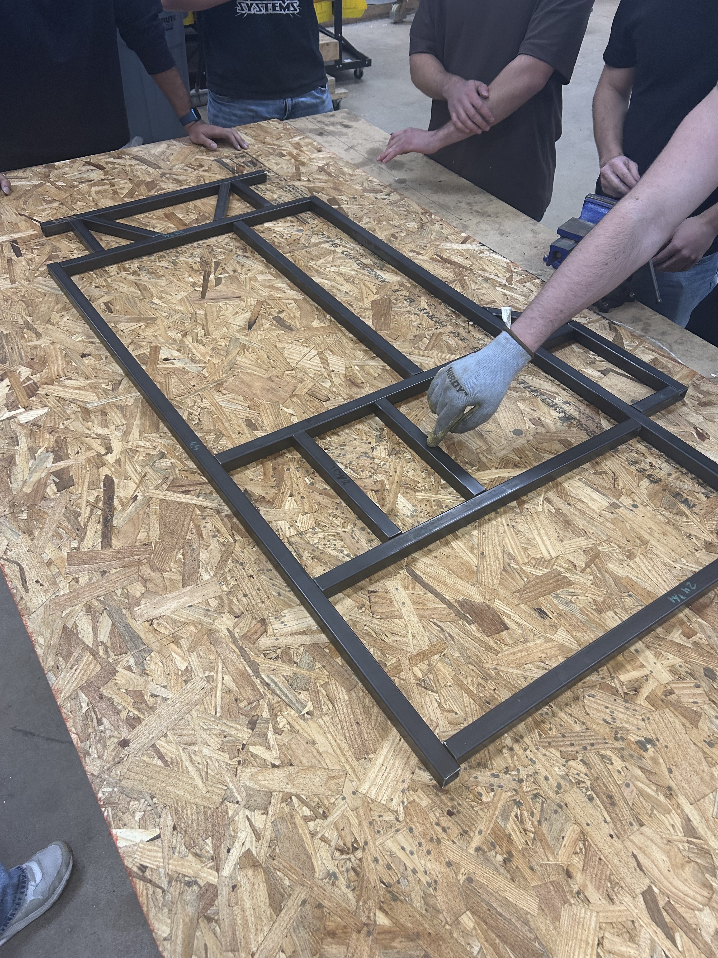 Unwelded go-kart frame in custom plywood fixturing jig