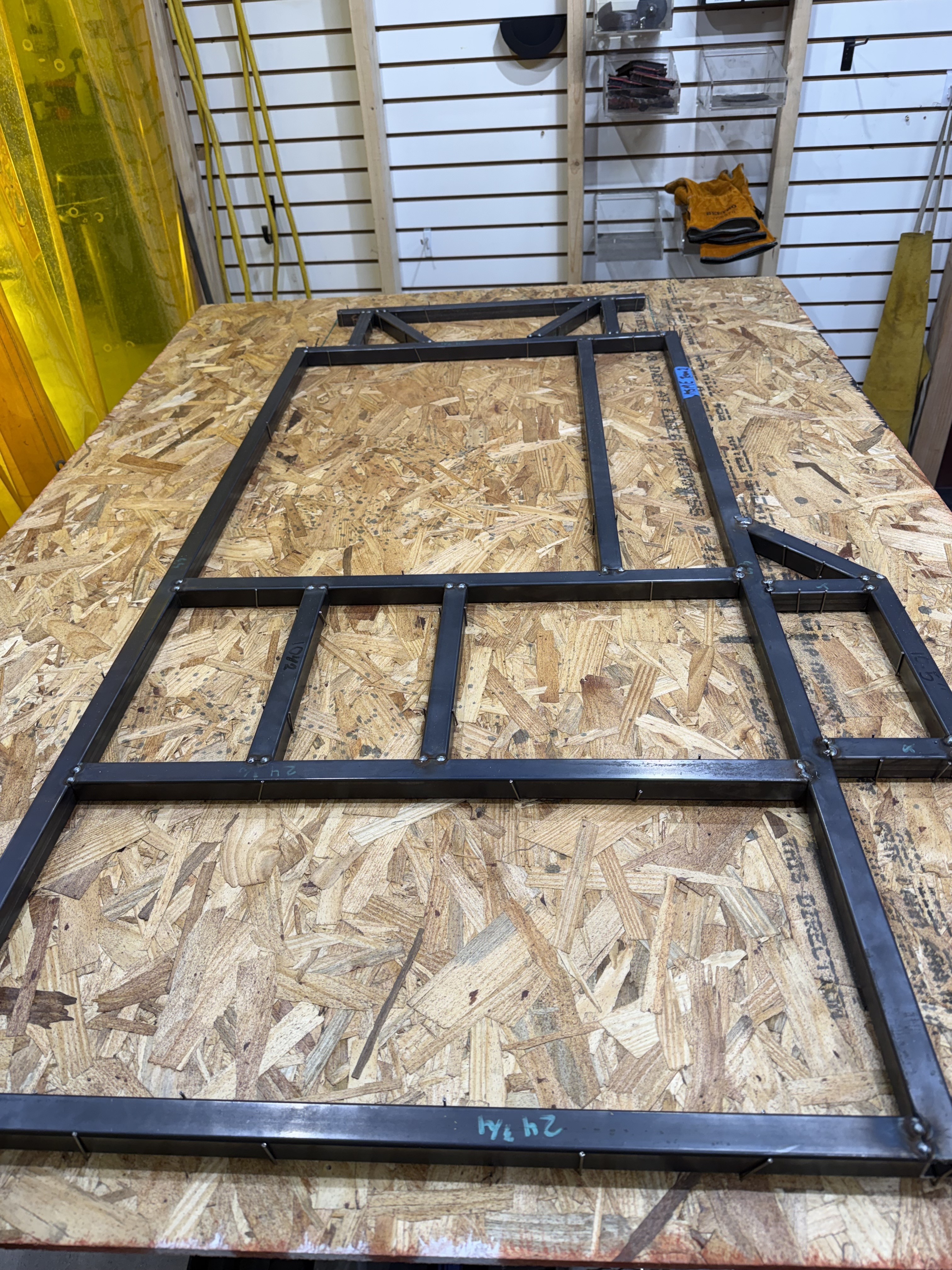 Tacked frame in custom plywood fixturing jig