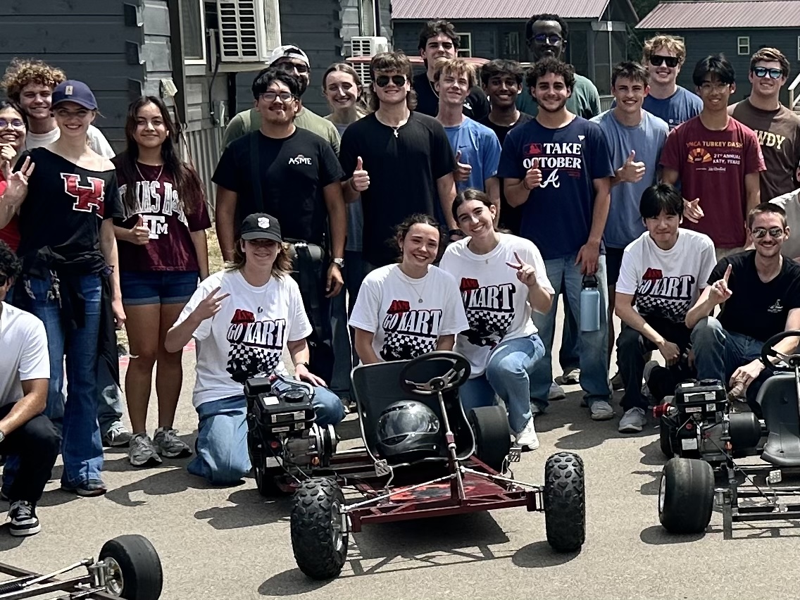 ASME Go-Kart team in front of finished chassis at competition